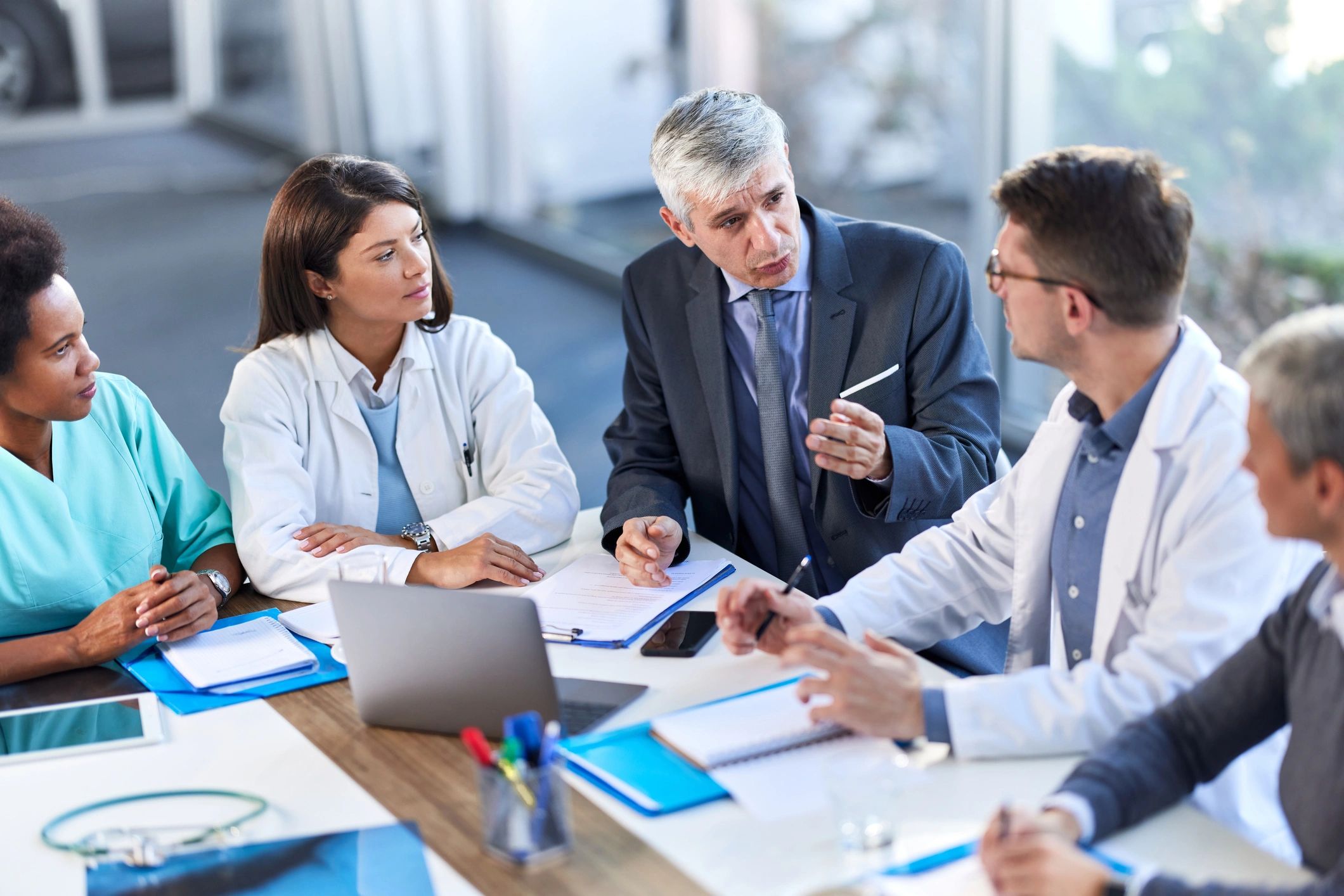 Healthcare team meeting with an administrator