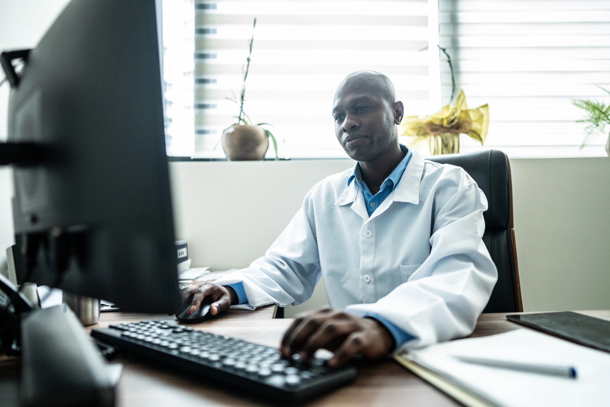 Doctor using a computer in a medical office