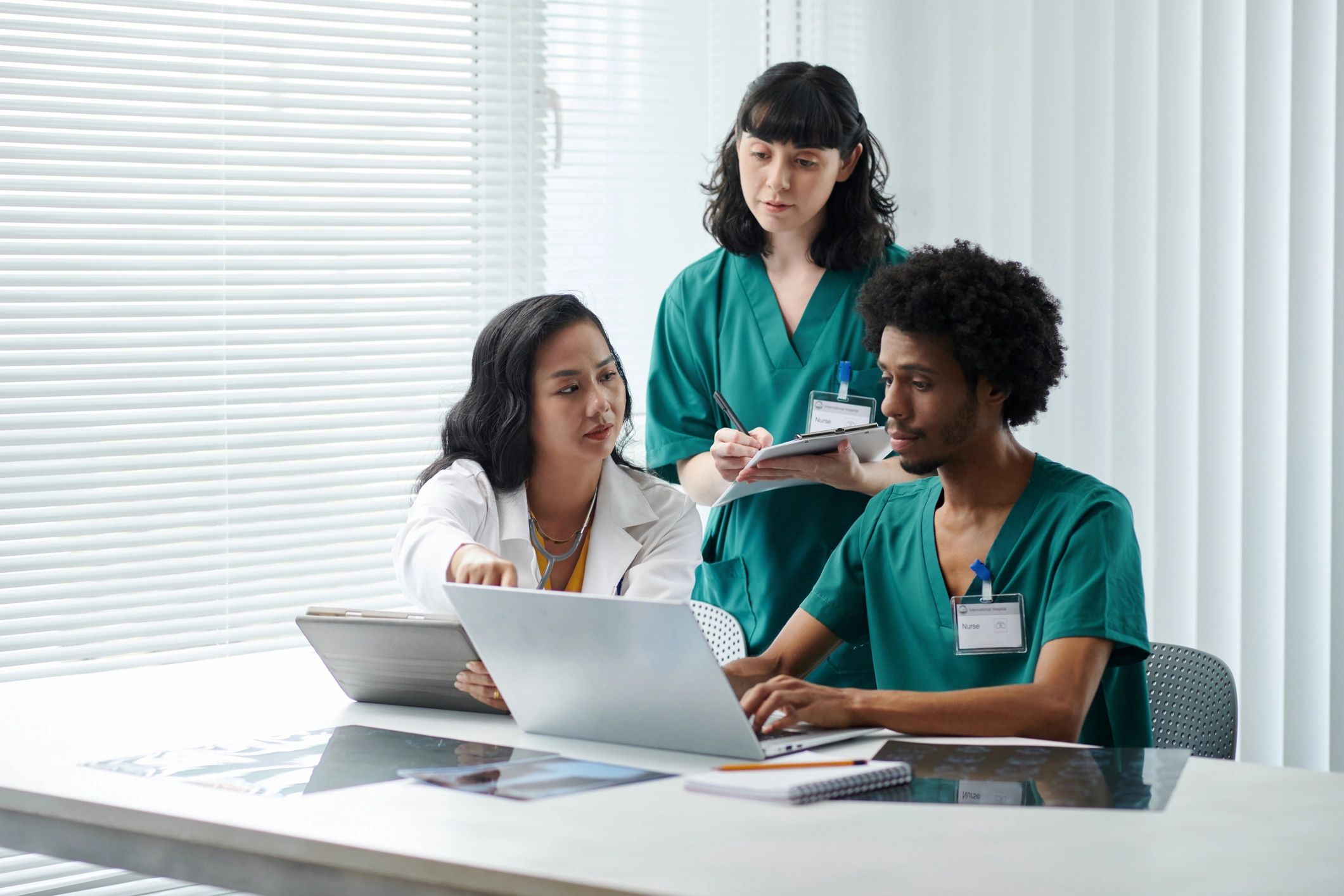 Medical staff preparing documents and reviewing patient data