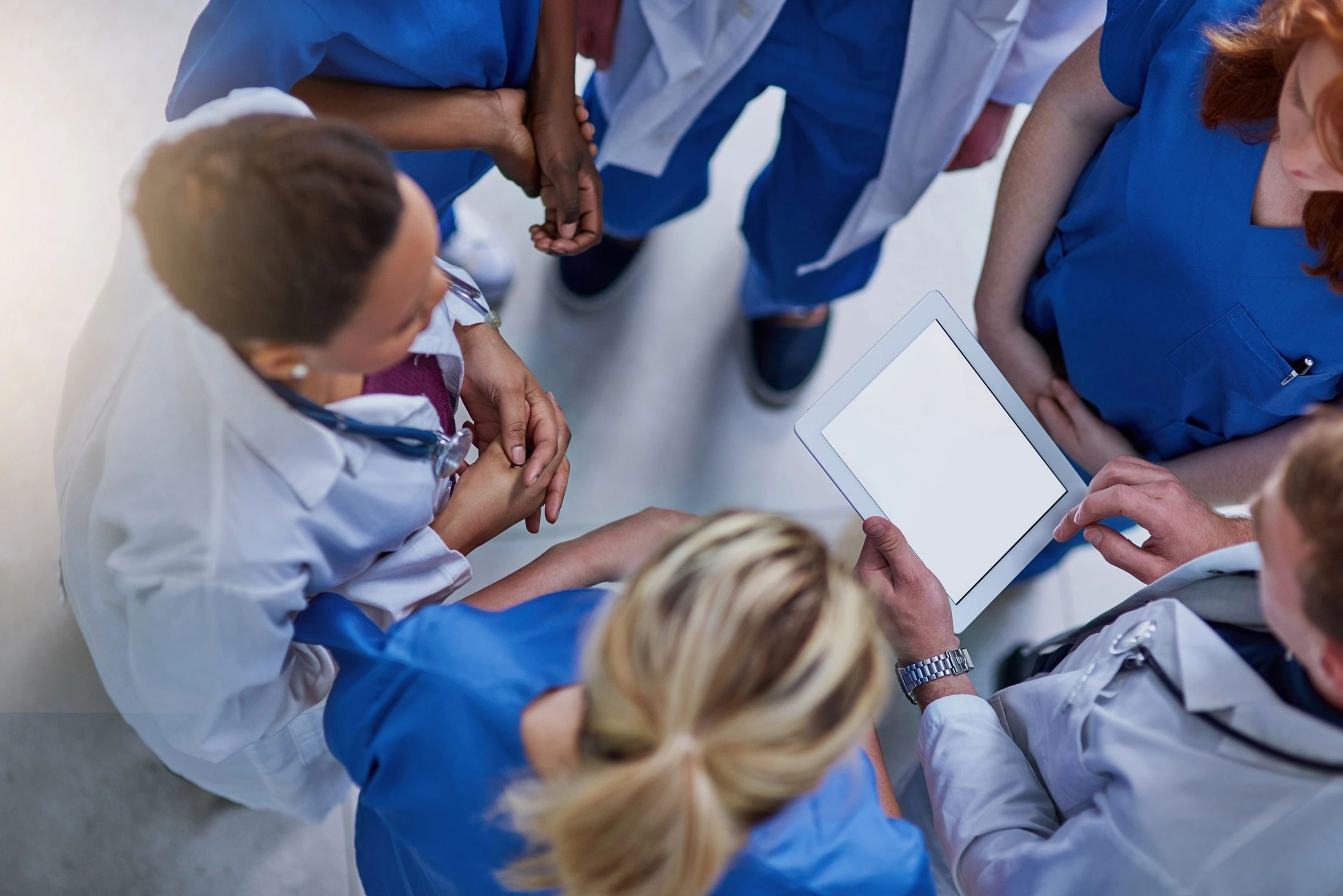 Team reviewing information on a tablet